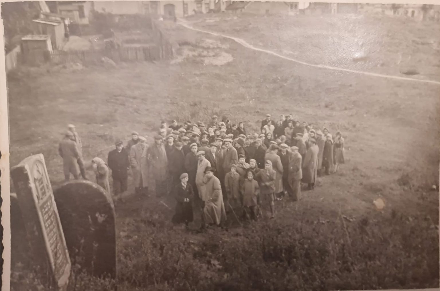 Jack standing near mass grave at Ostrowiec Cemetery - Oct 7 1945