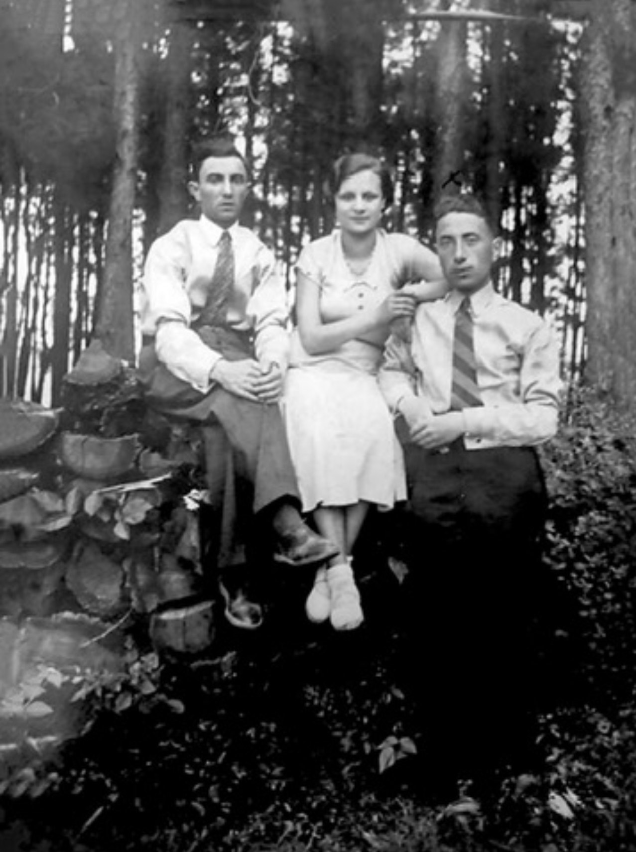 From right to left: Shlomo Lerman,his sister Chaya Rywka , and her husband Josef Grynblum. Background forest in Poland